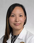 Portrait of Julie LE, MD in a white lab coat